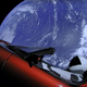 Starman, seen getting excellent range in his Tesla Roadster.